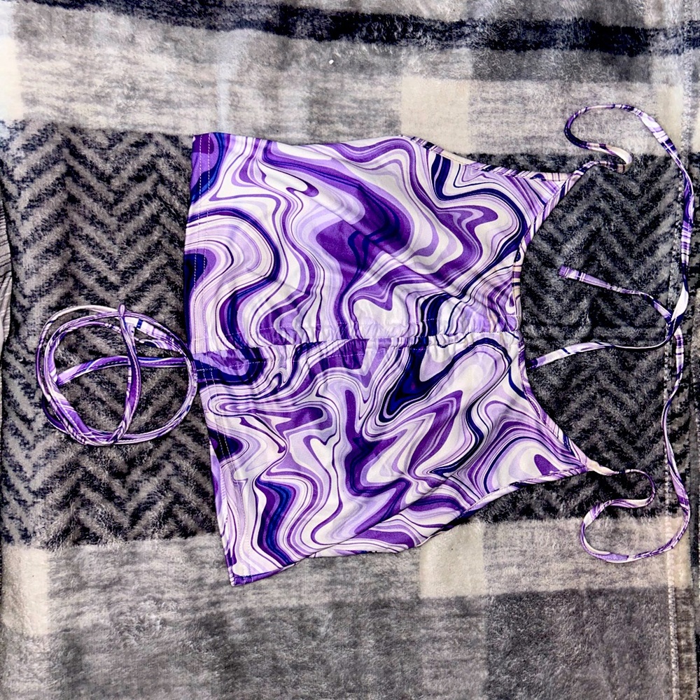 Purple colored cropped tank top with synch up middle tie around neck